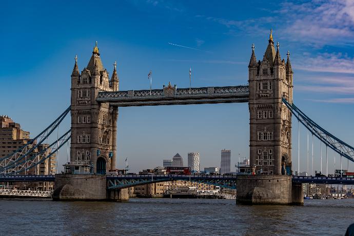 brown concrete bridge under blue sky during daytime