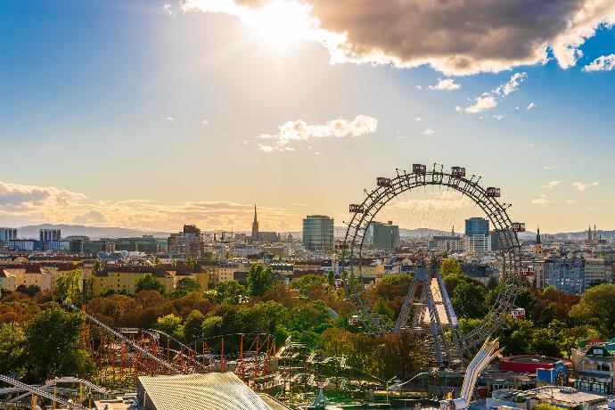 white ferris wheel near city buildings during daytime